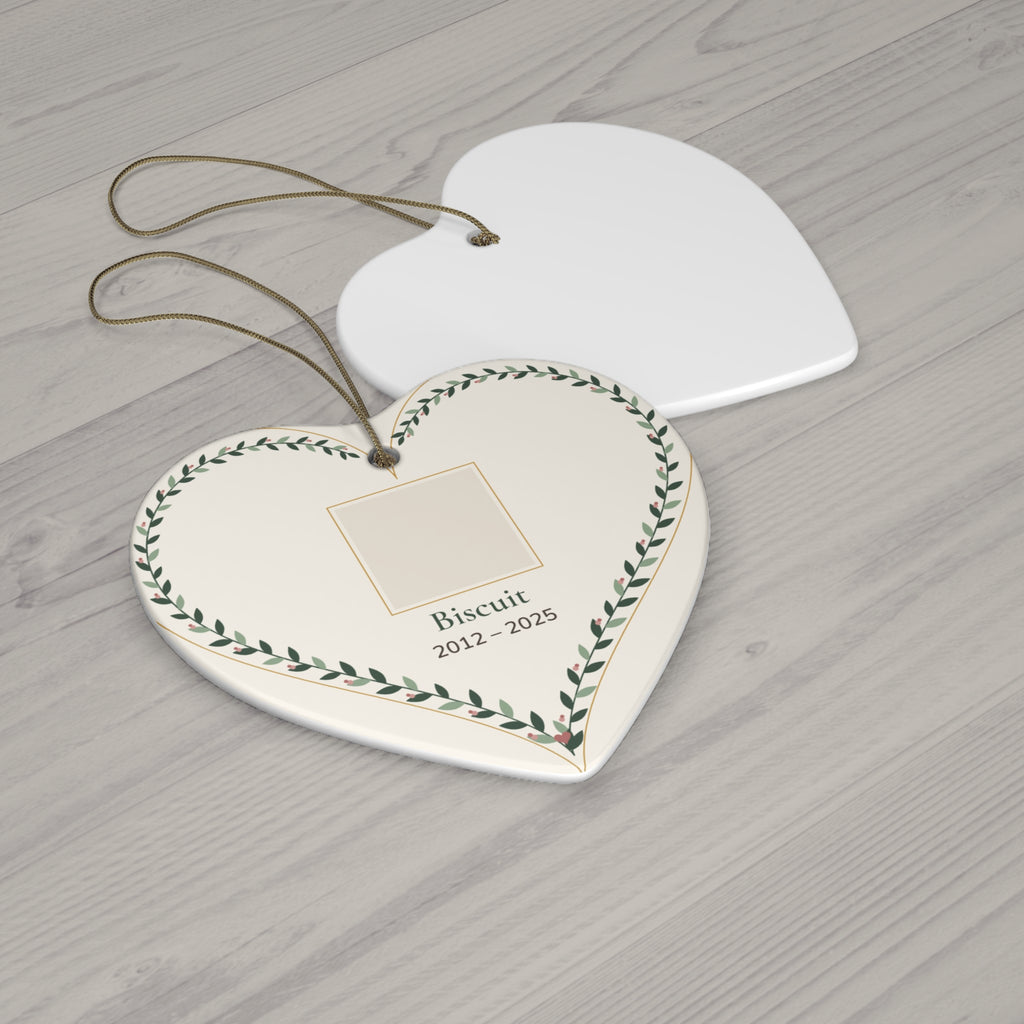 Heart-shaped ceramic pet memorial ornament with a personalized pet photo, name and dates inside a leafy vine border - view 2