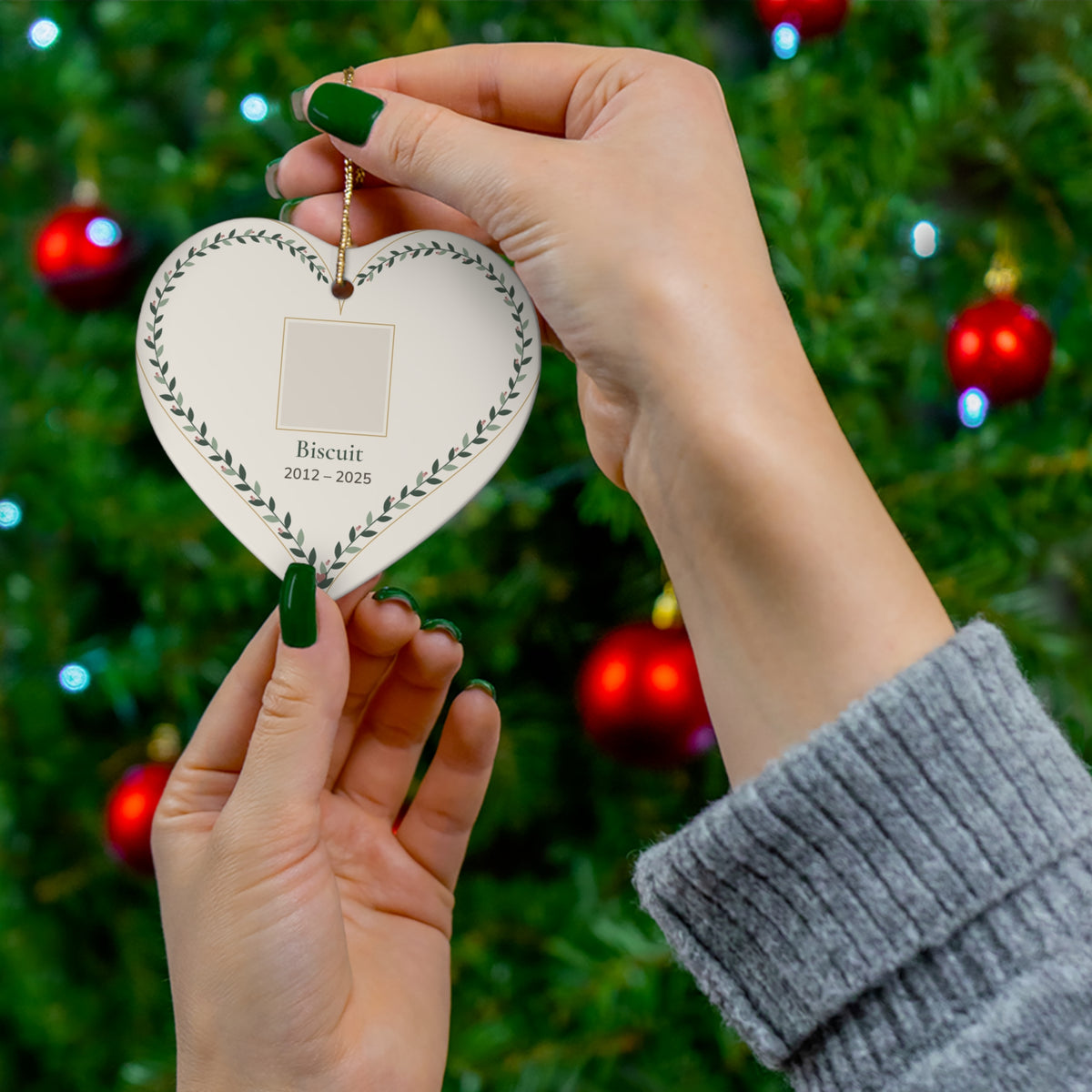 Heart-shaped ceramic pet memorial ornament with a personalized pet photo, name and dates inside a leafy vine border - view 3