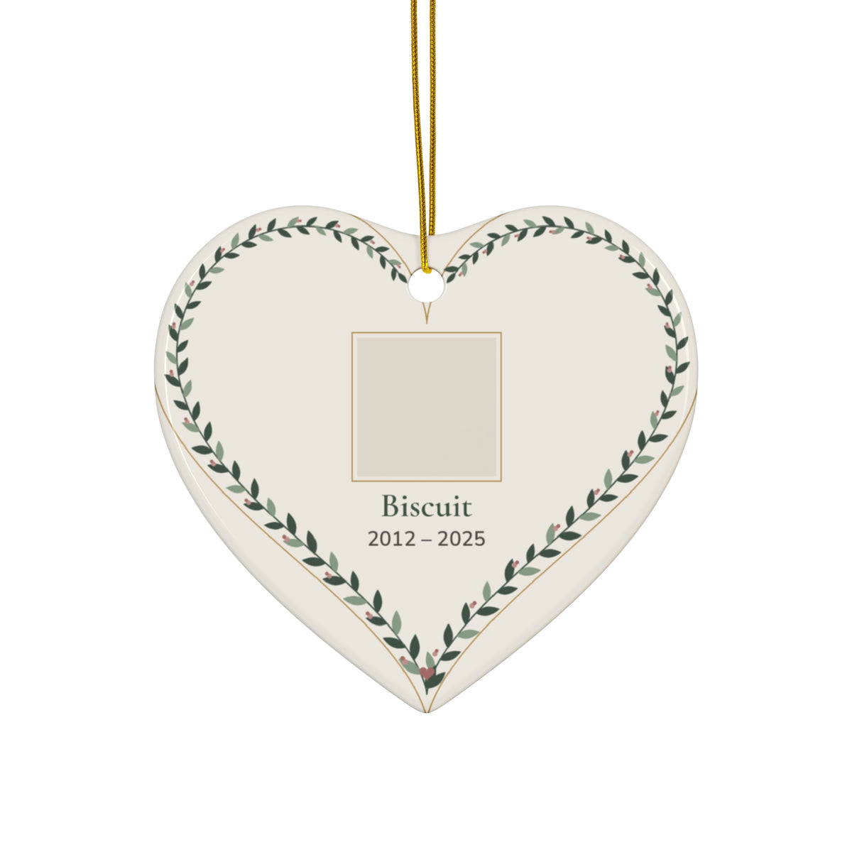 Heart-shaped ceramic pet memorial ornament with a personalized pet photo, name and dates inside a leafy vine border